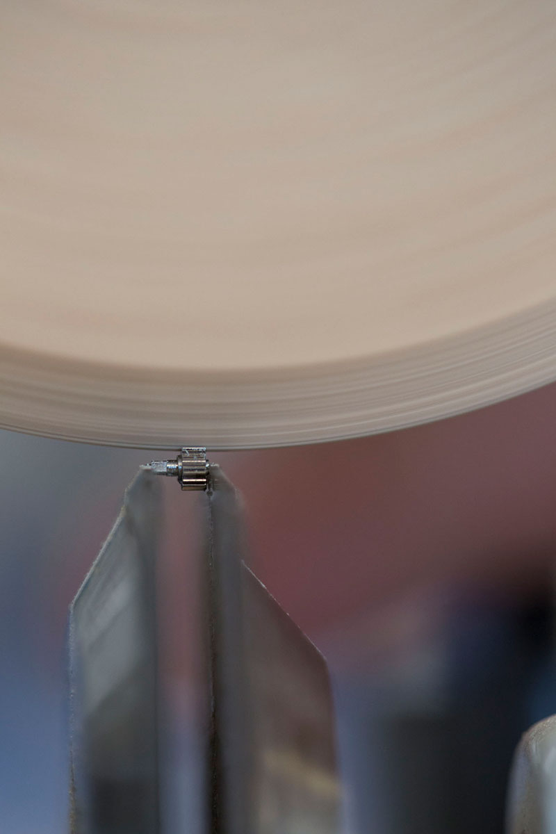 Closeup view of a traditional finishing technique with wooden wheel